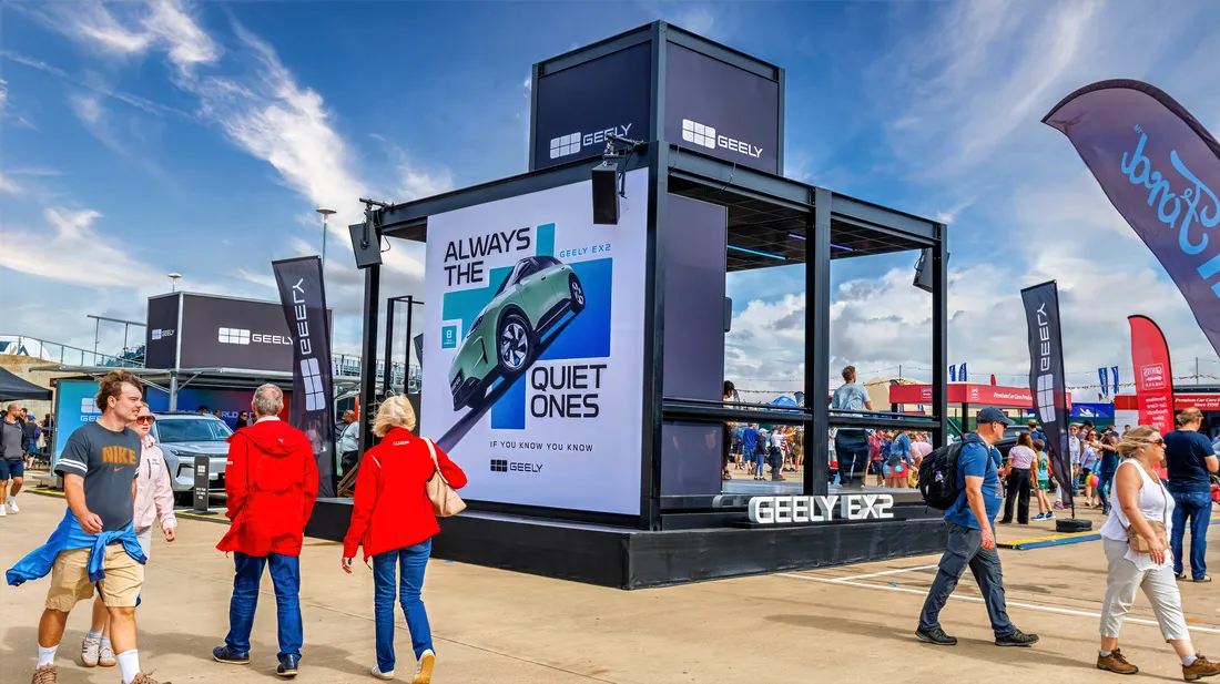 Modular pop-up structure with external branding and custom cladding