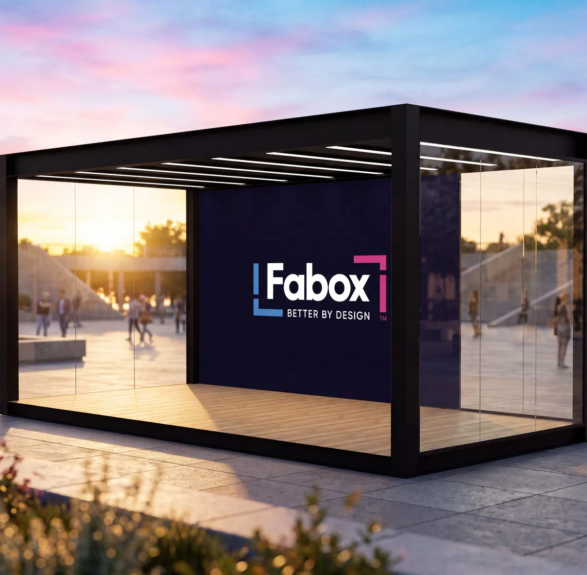 A glazed Fabox unit at dusk with a branded rear panel and timber deck